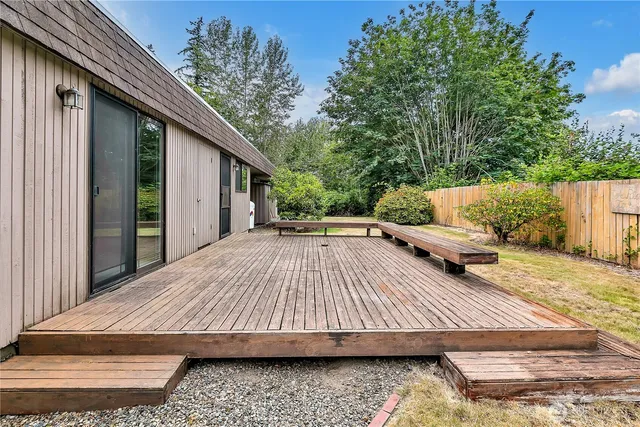 a view of backyard with patio