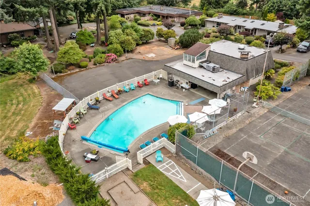 an aerial view of a house with a swimming pool