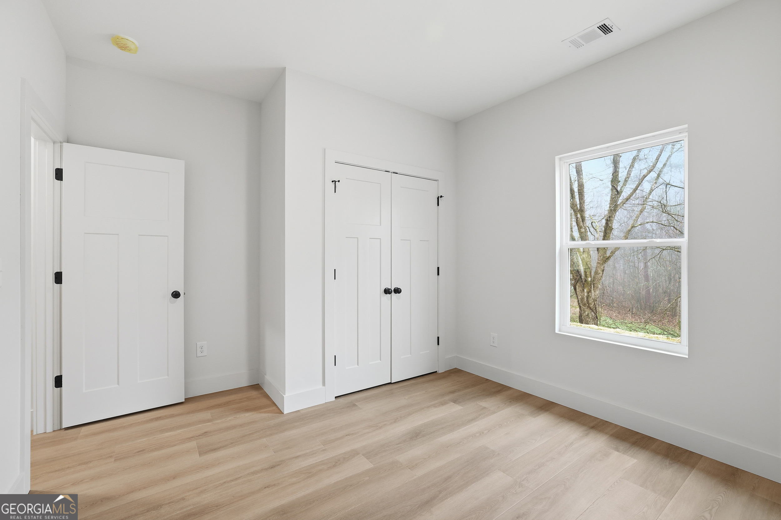 146 James Road Clarkesville, GA 30523 - Photo 17 of 25 a view of an empty room and window