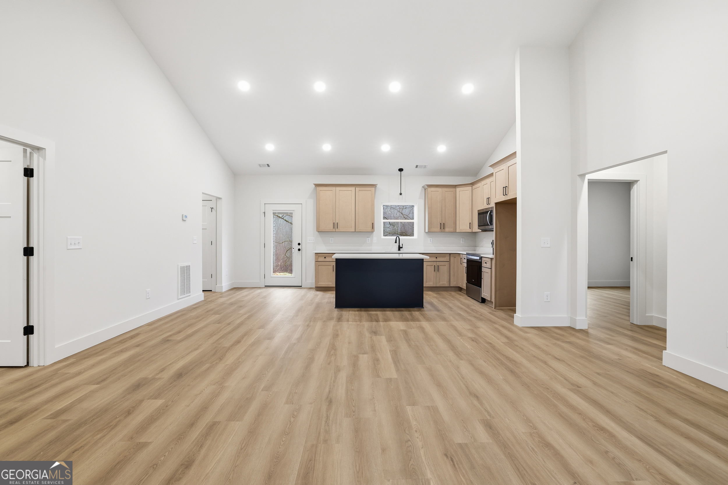 146 James Road Clarkesville, GA 30523 - Photo 5 of 25 a view of a kitchen with a sink and a refrigerator