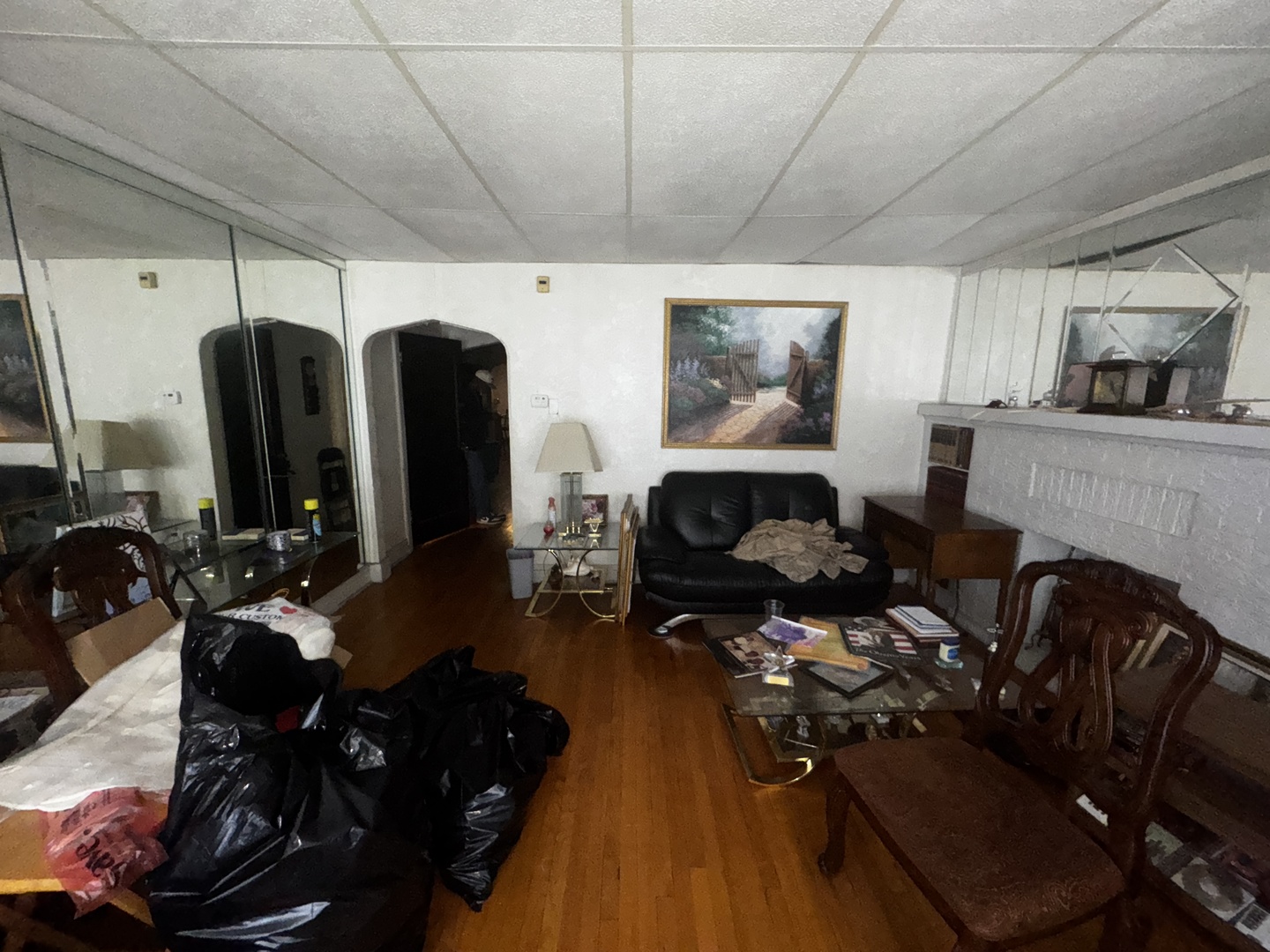 7940 South Marshfield Avenue Chicago, IL 60620 - Photo 2 of 4 a living room with lots of furniture and gym equipment