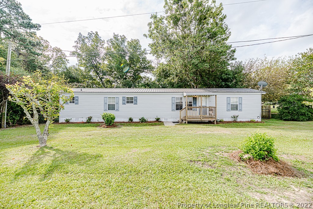 256 Union Church Road Carthage, NC 28327 - Photo 1 of 29 a front view of house with yard and trees