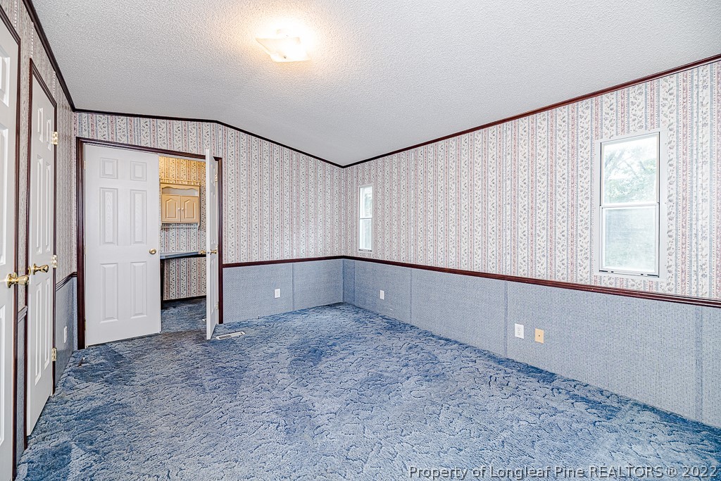 256 Union Church Road Carthage, NC 28327 - Photo 16 of 29 a view of an empty room with a window