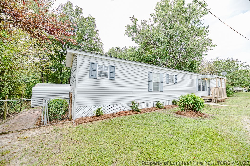 256 Union Church Road Carthage, NC 28327 - Photo 2 of 29 a view of a house with a yard