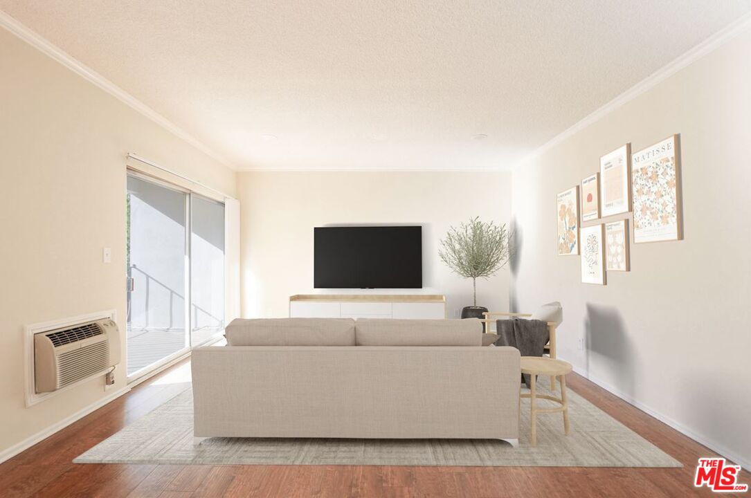 1677 Westholme Avenue Los Angeles, CA 90024 - Photo 11 of 43 a living room with furniture and a flat screen tv
