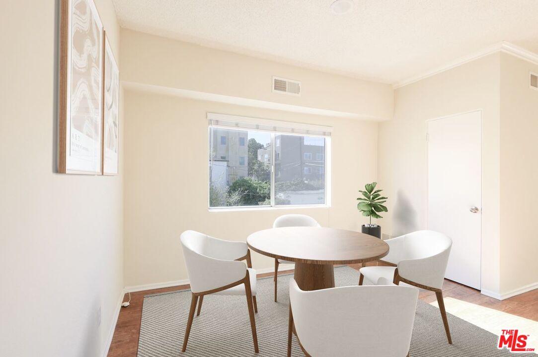 1677 Westholme Avenue Los Angeles, CA 90024 - Photo 12 of 43 a view of a room with furniture and wooden floor