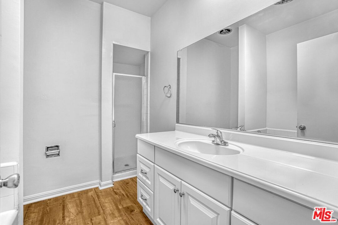 1677 Westholme Avenue Los Angeles, CA 90024 - Photo 31 of 43 a bathroom with a sink and a mirror