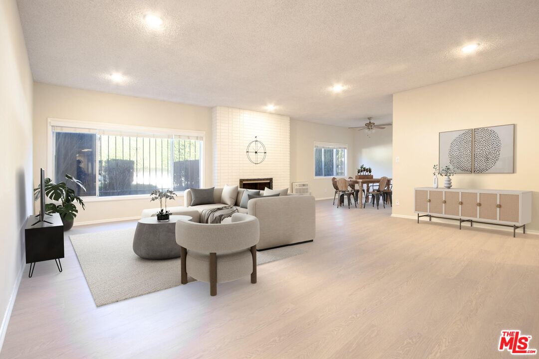 1677 Westholme Avenue Los Angeles, CA 90024 - Photo 6 of 43 a living room with furniture and a large window