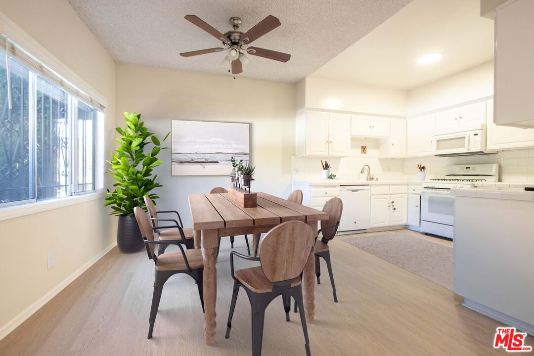 1677 Westholme Avenue Los Angeles, CA 90024 - Photo 8 of 43 a view of a dining room with furniture and a potted plant