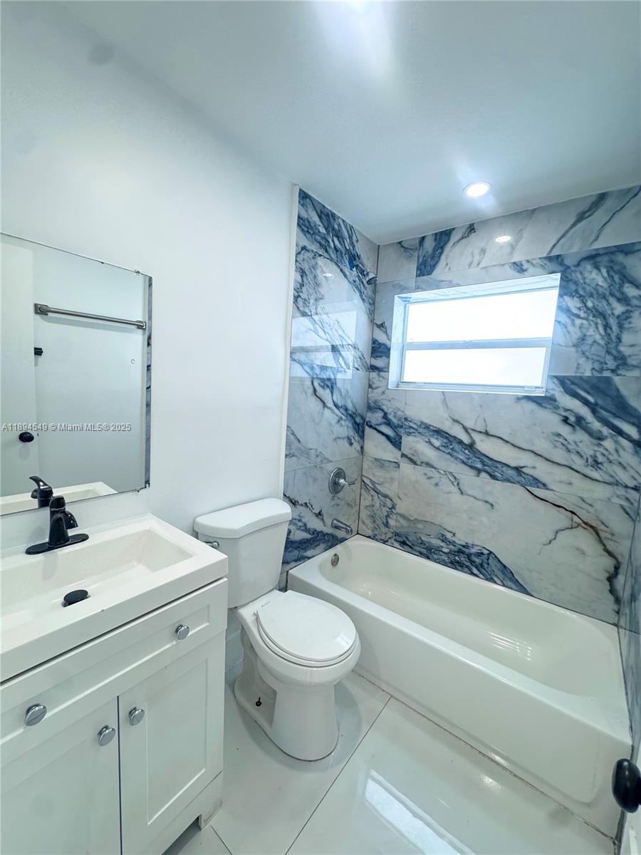 3731 Southwest 58th Terrace Davie, FL 33314 - Photo 15 of 17 a bathroom with a sink a toilet and a bathtub