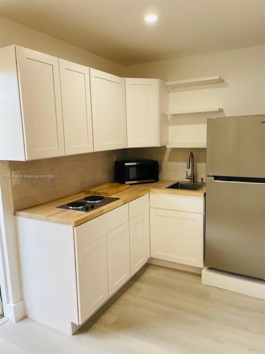 3731 Southwest 58th Terrace Davie, FL 33314 - Photo 16 of 17 a utility room with washer and dryer