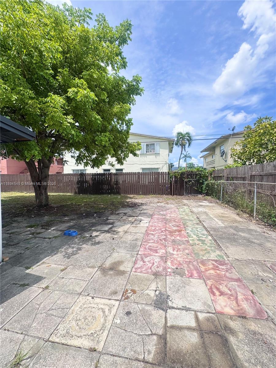 3731 Southwest 58th Terrace Davie, FL 33314 - Photo 10 of 17 a front view of a house with a yard