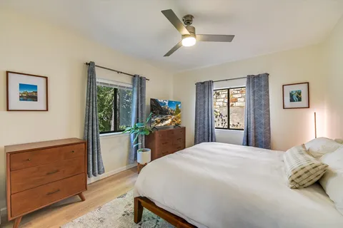 a bedroom with a bed and a dresser