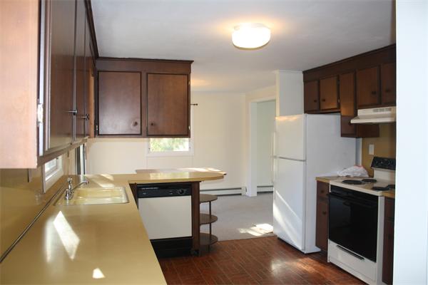 38 Richfield Road Scituate, MA 02066 - Photo 5 of 13 a kitchen with stainless steel appliances a refrigerator a sink a stove and cabinets