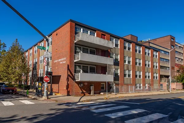 a front view of a building with street view