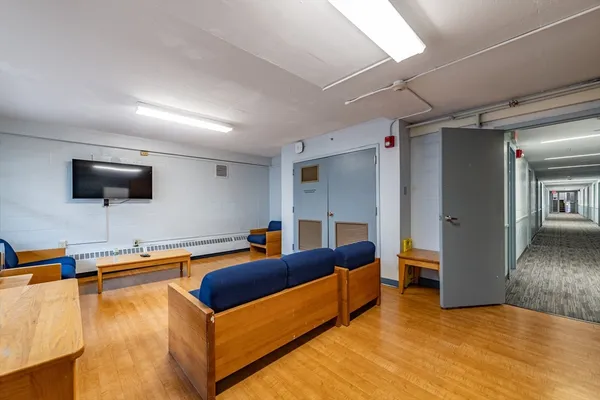 a bedroom with a bed and a flat screen television