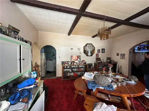 a living room with lots of furniture and a clock