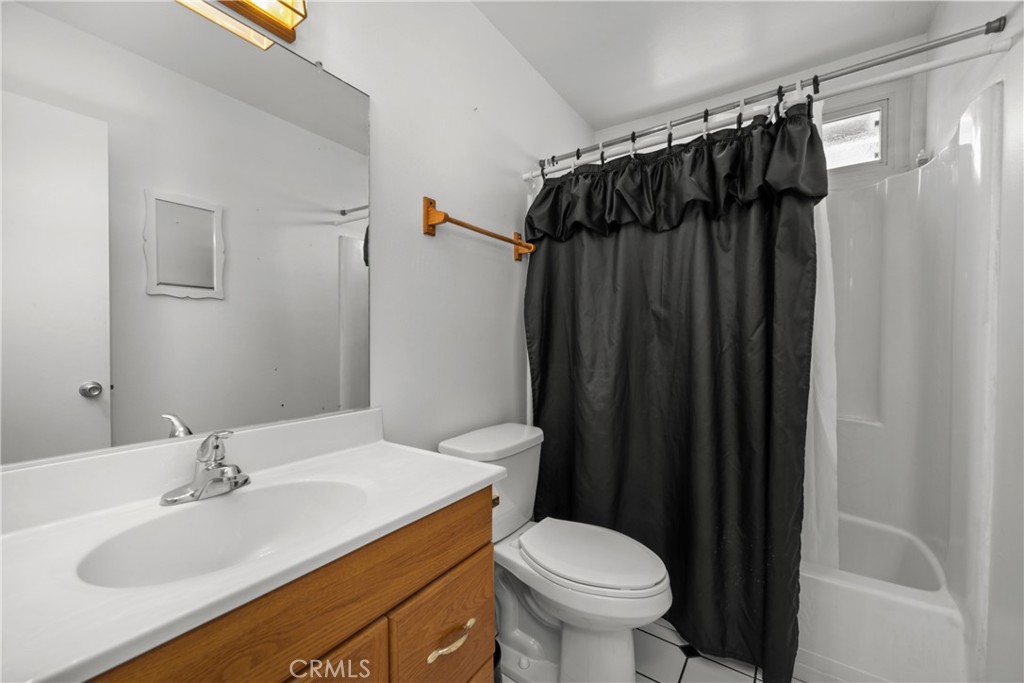 9152 Lakeview Road Lakeside, CA 92040 - Photo 13 of 32 a bathroom with a sink and a mirror