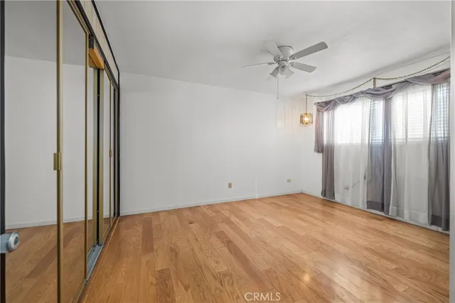 a view of a room with a ceiling fan