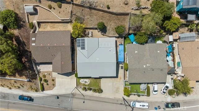 an aerial view of houses with yard