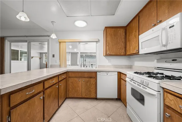 a kitchen with stainless steel appliances granite countertop a sink and cabinets