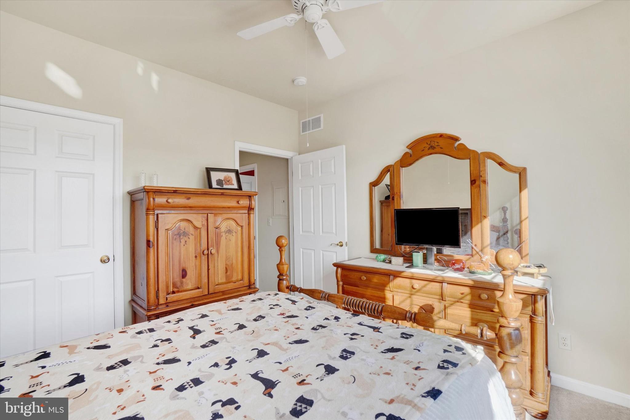 1010 Crest Way, Unit 304 York, PA 17403 - Photo 14 of 22 a bedroom with a bed and a flat screen tv