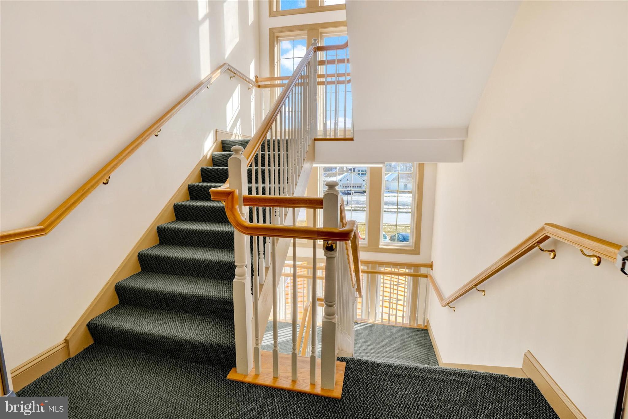 1010 Crest Way, Unit 304 York, PA 17403 - Photo 22 of 22 a view of staircase with lots of frames on wall and a window
