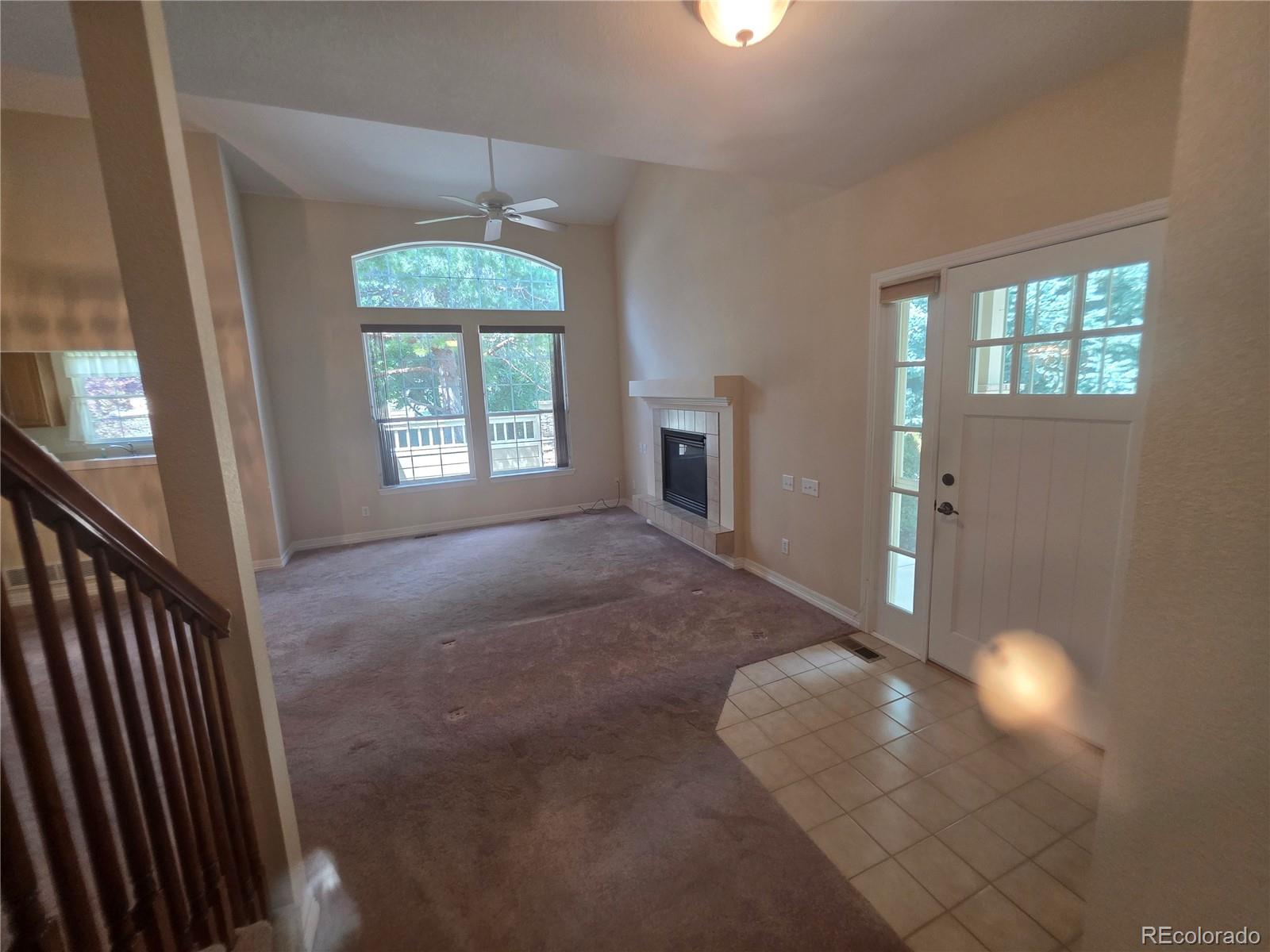 8911 Tappy Toorie Place Highlands Ranch, CO 80129 - Photo 11 of 28 a furnished livingroom with windows and chandelier