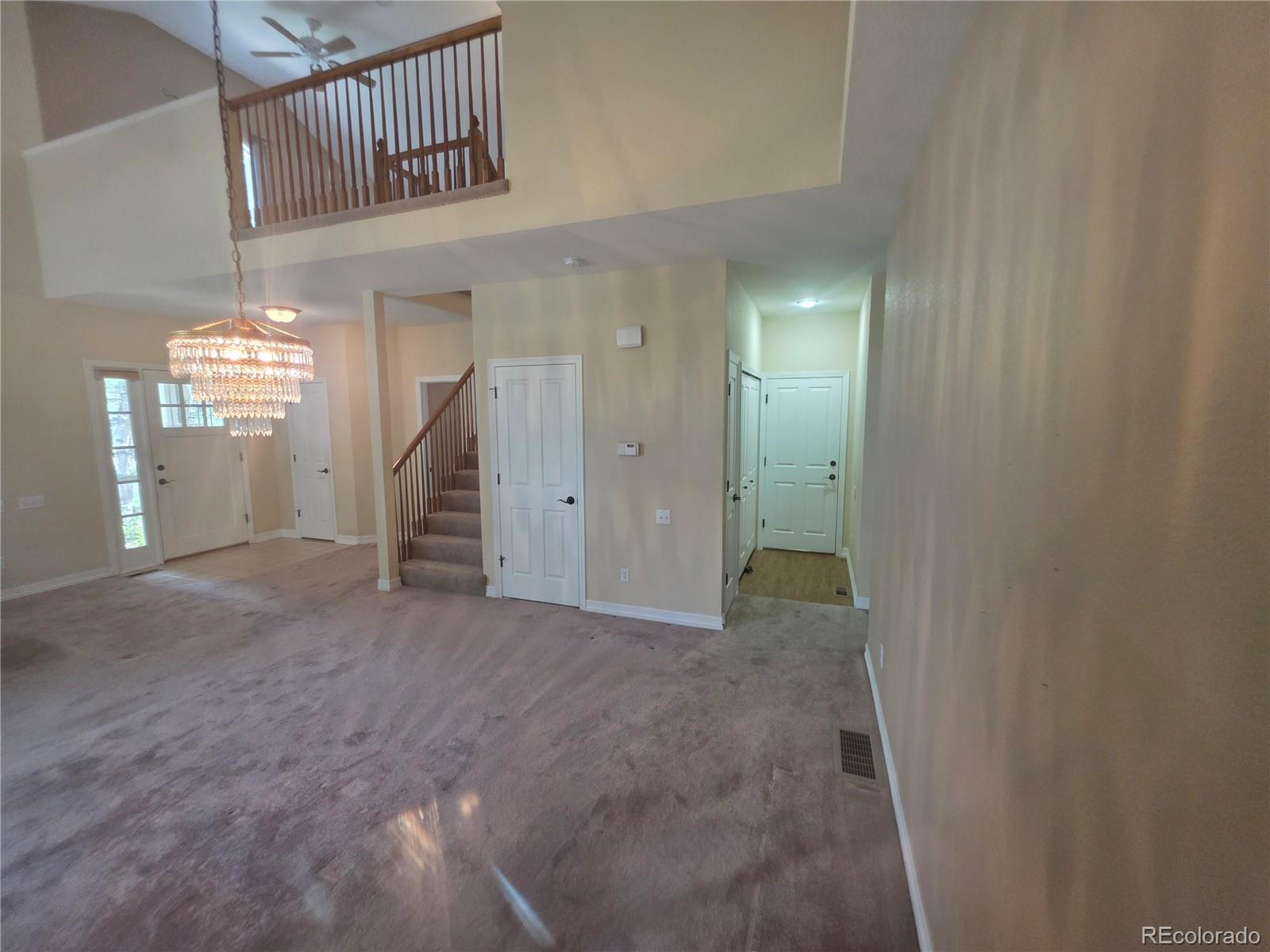 8911 Tappy Toorie Place Highlands Ranch, CO 80129 - Photo 12 of 28 a view of a hallway with entryway