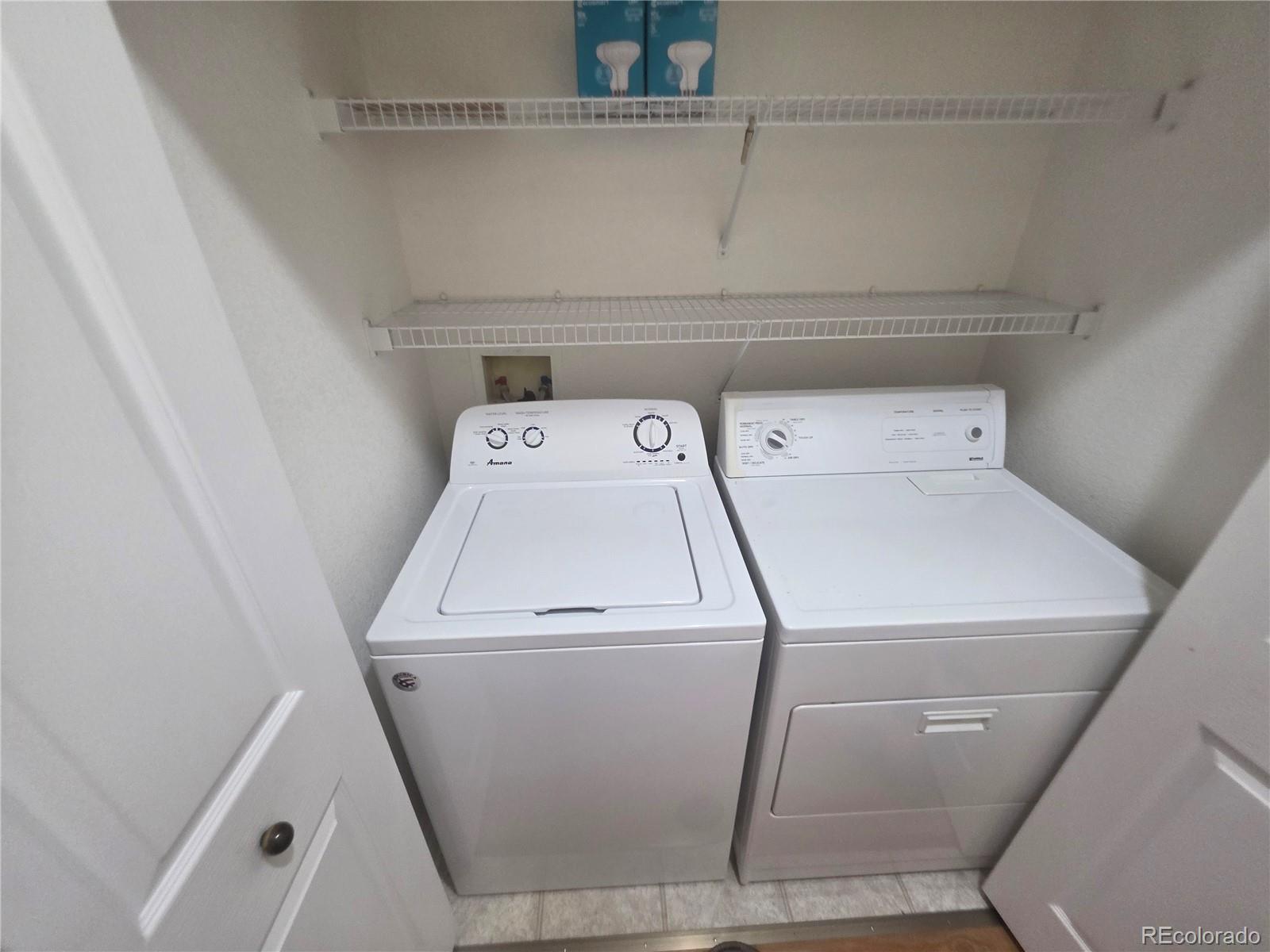 8911 Tappy Toorie Place Highlands Ranch, CO 80129 - Photo 16 of 28 a utility room with dryer and washer