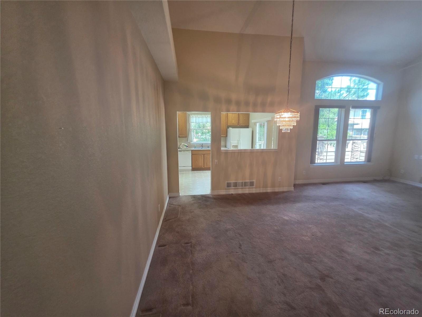 8911 Tappy Toorie Place Highlands Ranch, CO 80129 - Photo 21 of 28 an empty room with windows
