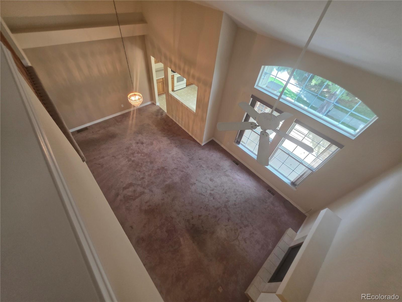 8911 Tappy Toorie Place Highlands Ranch, CO 80129 - Photo 24 of 28 a view of empty room with windows