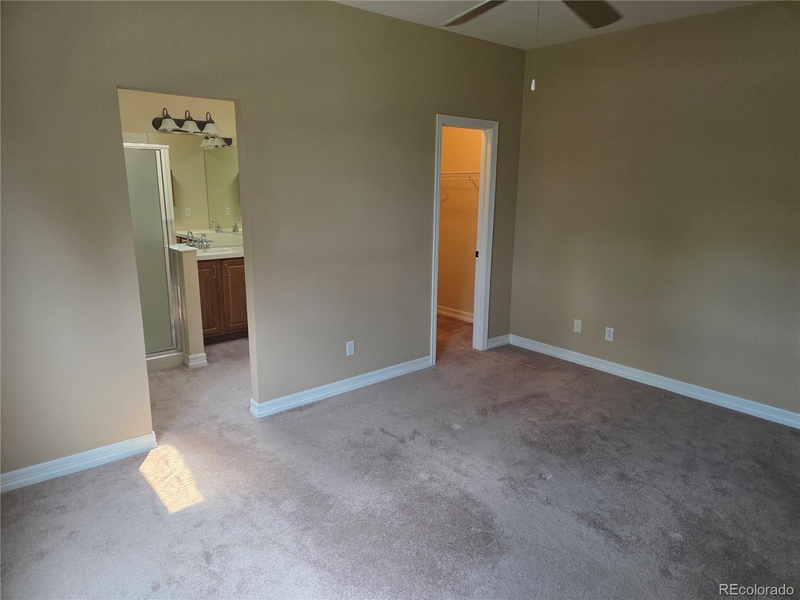 8911 Tappy Toorie Place Highlands Ranch, CO 80129 - Photo 5 of 28 an empty room with a gallery and wooden floor