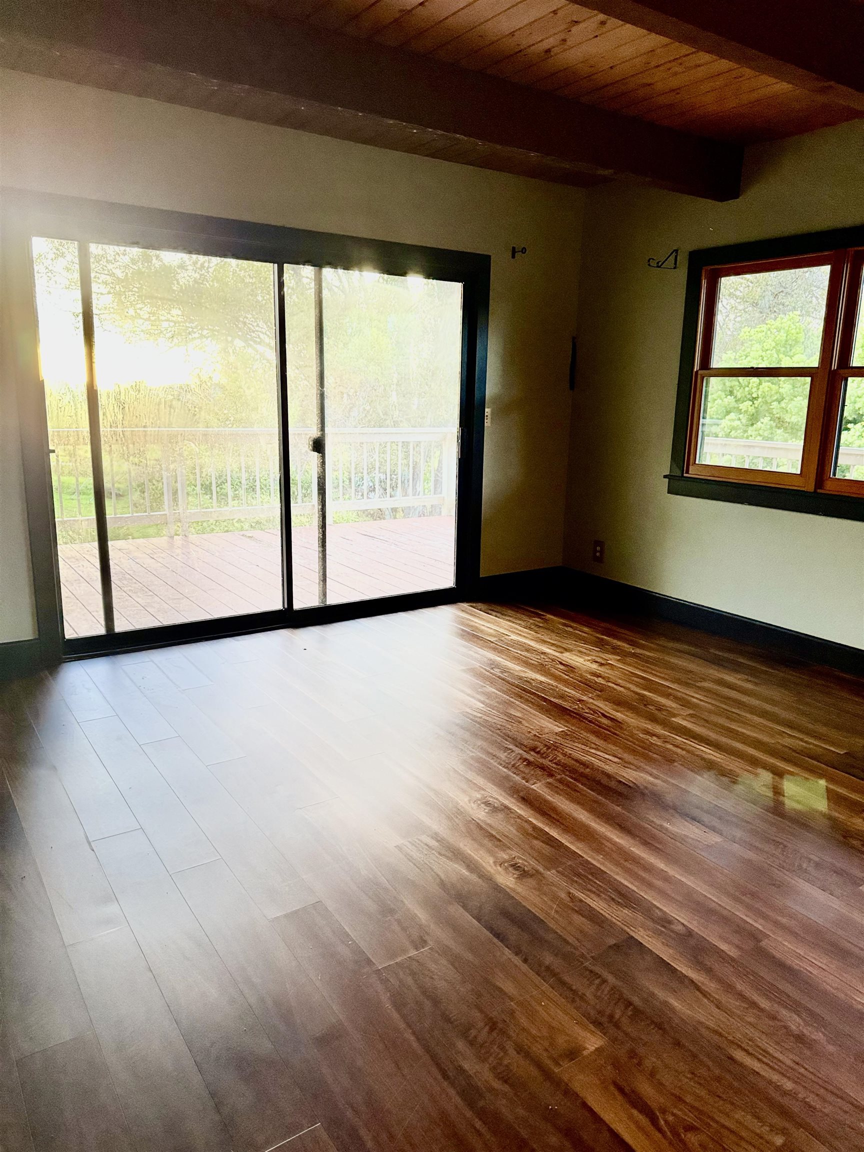 2400 Piiholo Road Makawao, HI 96768 - Photo 29 of 45 a view of an empty room with a window and wooden floor