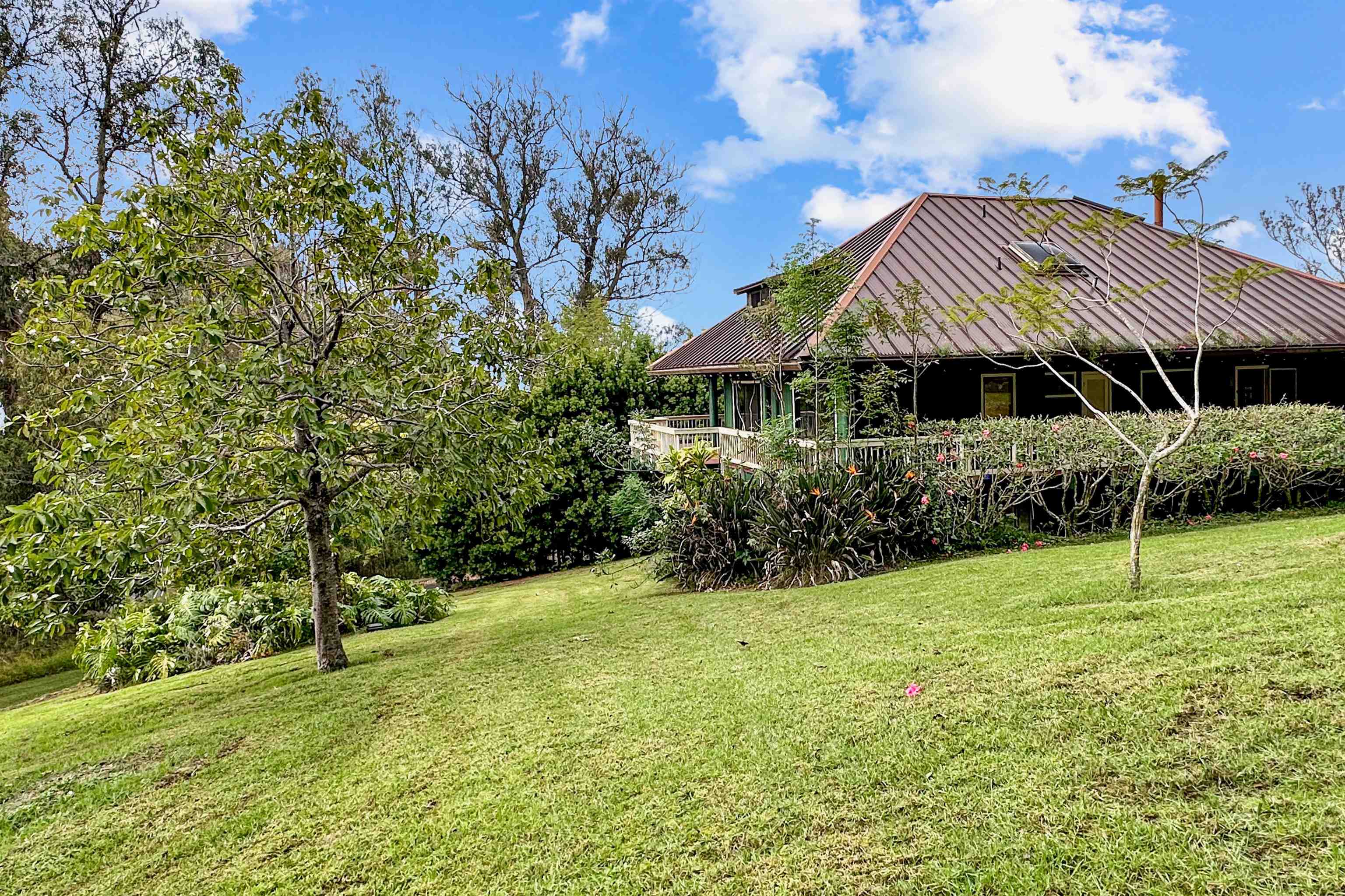 2400 Piiholo Road Makawao, HI 96768 - Photo 10 of 45 a view of a house with a yard and sitting area