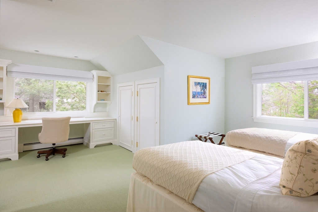 291 Goddard Avenue, Unit 291 Brookline, MA 02445 - Photo 13 of 19 a bedroom with a bed and a window