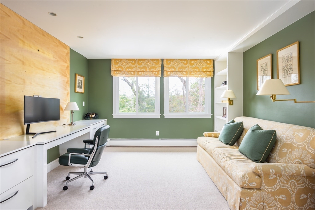 291 Goddard Avenue, Unit 291 Brookline, MA 02445 - Photo 15 of 19 a living room with furniture and a window