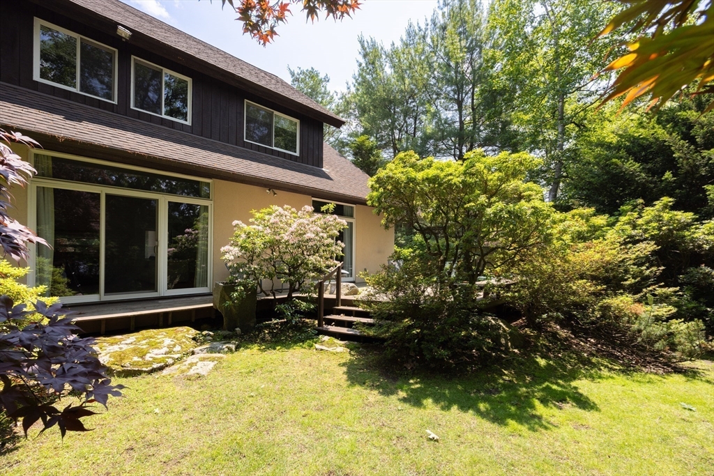 291 Goddard Avenue, Unit 291 Brookline, MA 02445 - Photo 19 of 19 a front view of a house with a yard