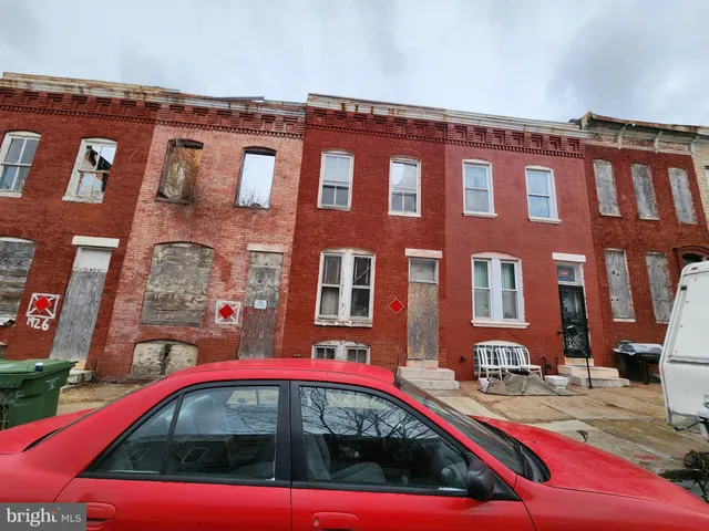 a view of building with lot of cars parked