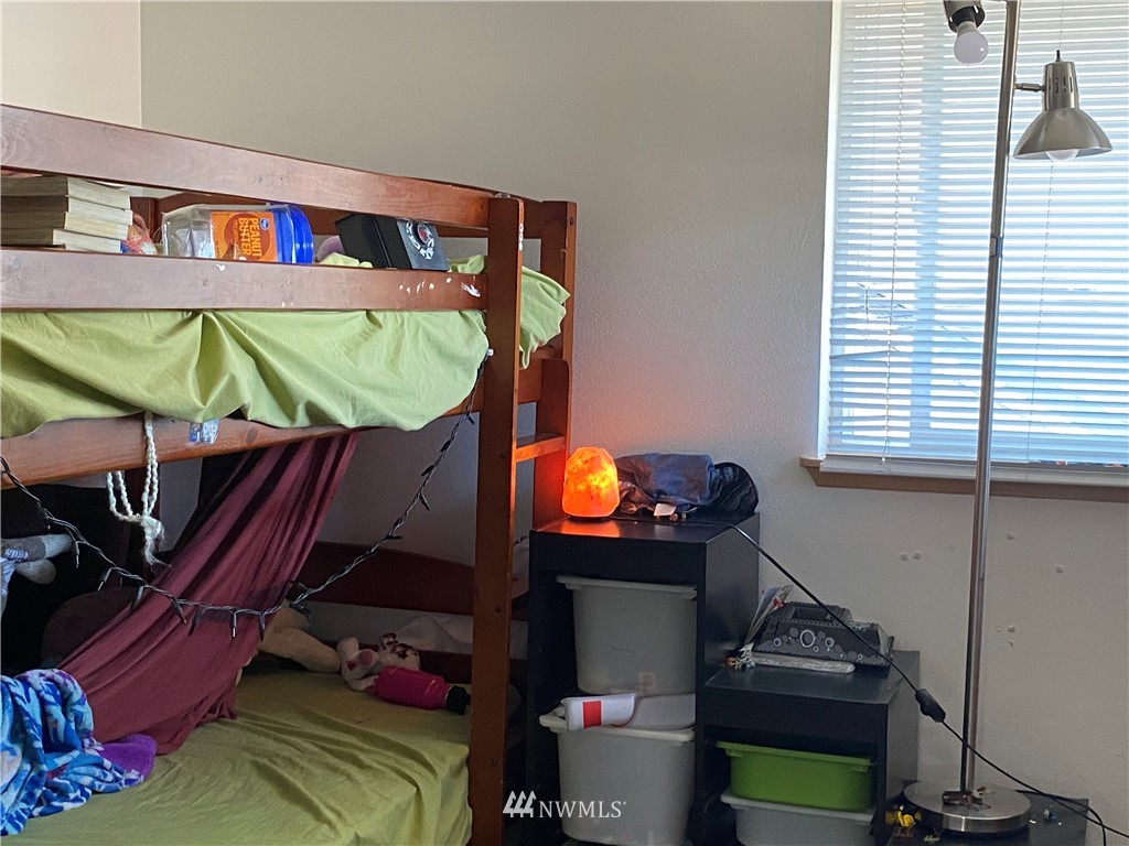 2105 Michigan Street Bellingham, WA 98229 - Photo 17 of 38 a living room with chairs and a dining table