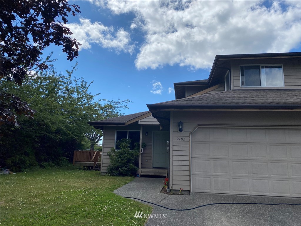 2105 Michigan Street Bellingham, WA 98229 - Photo 22 of 38 a front view of a house with a garden
