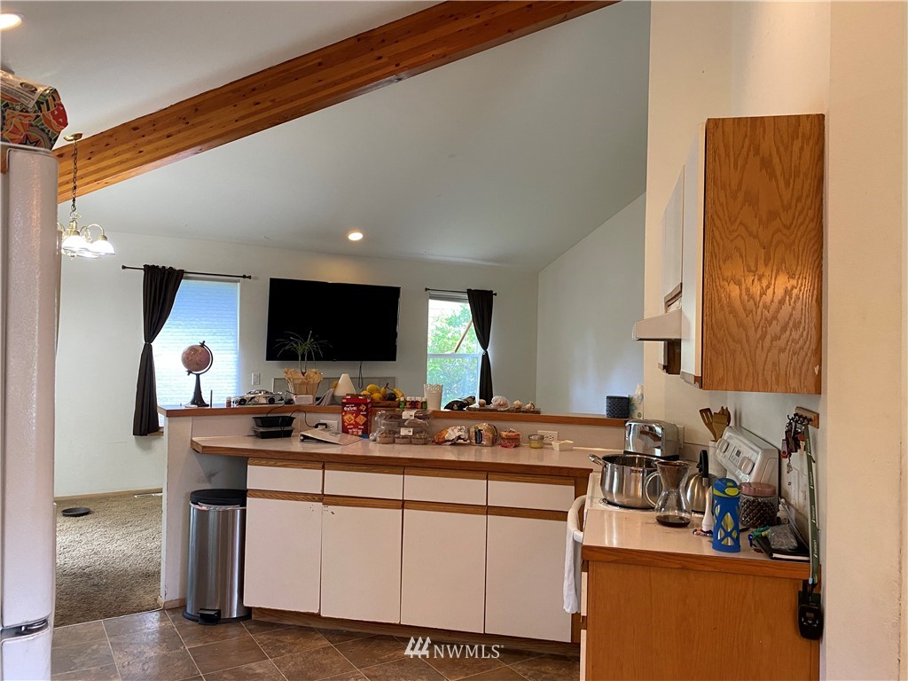 2105 Michigan Street Bellingham, WA 98229 - Photo 23 of 38 a kitchen with stainless steel appliances a sink stove and cabinets