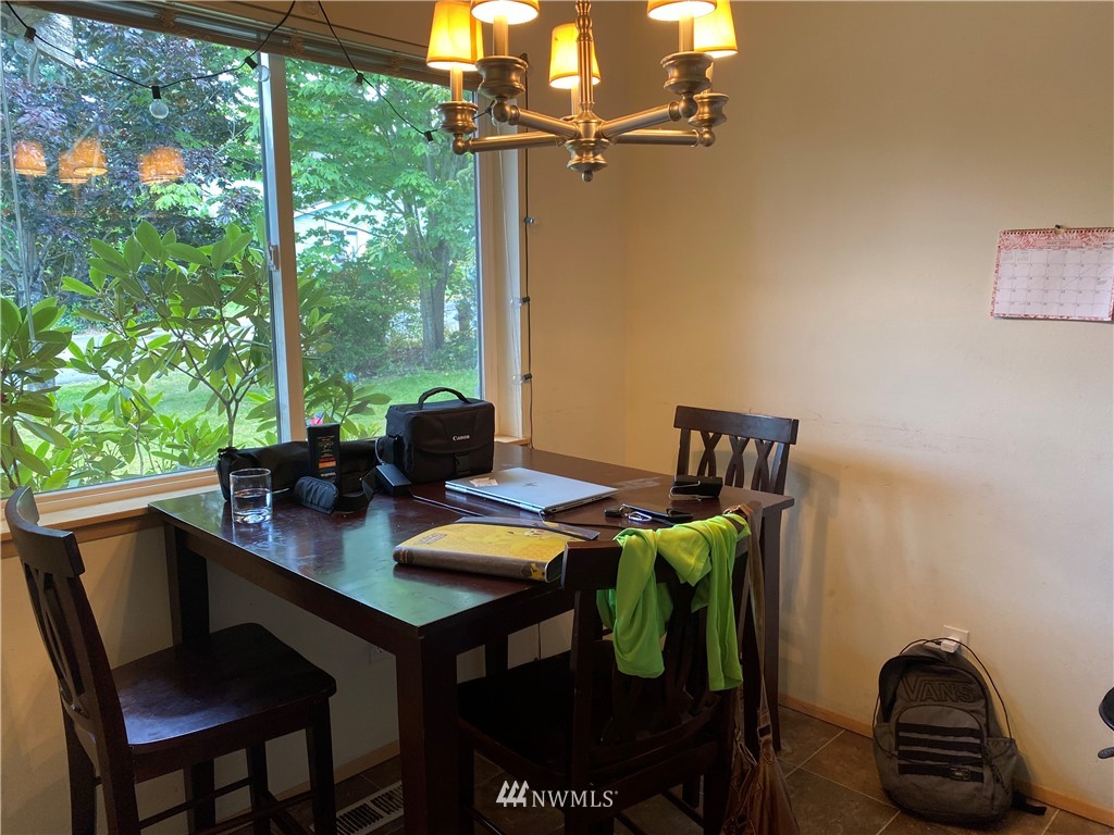 2105 Michigan Street Bellingham, WA 98229 - Photo 24 of 38 a view of a dining room with furniture and a window