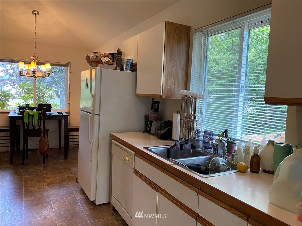 2105 Michigan Street Bellingham, WA 98229 - Photo 26 of 38 a kitchen with a sink and a refrigerator