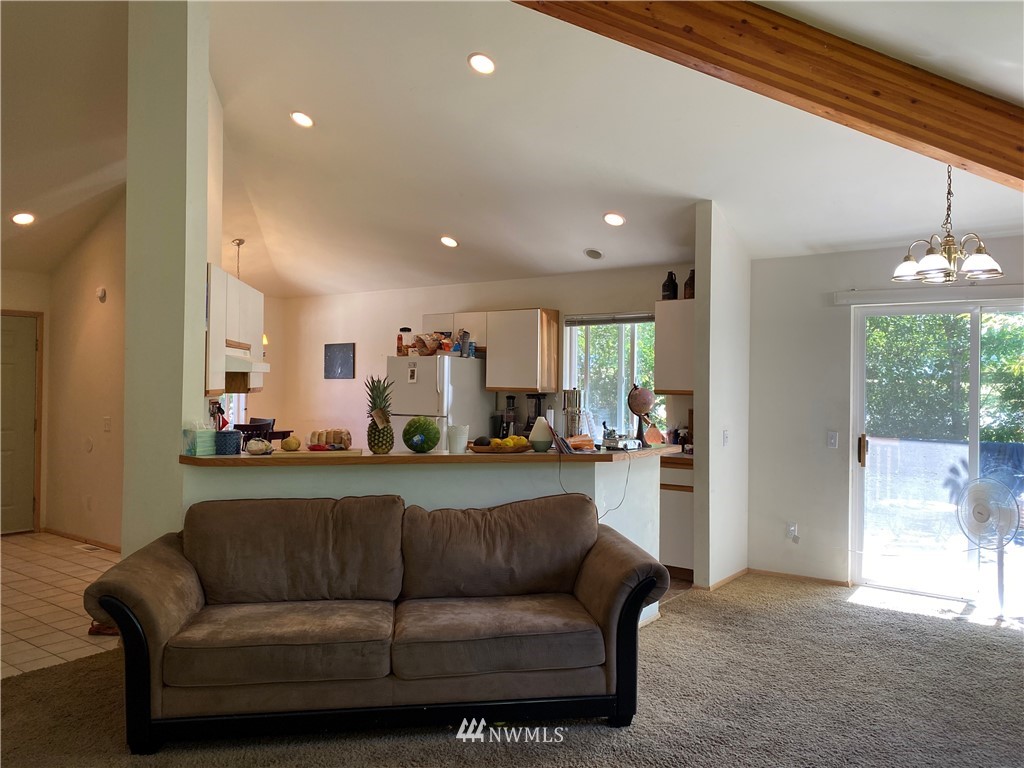 2105 Michigan Street Bellingham, WA 98229 - Photo 27 of 38 a living room with furniture and a chandelier