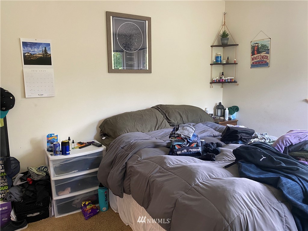 2105 Michigan Street Bellingham, WA 98229 - Photo 36 of 38 a bedroom with a bed and wooden floor