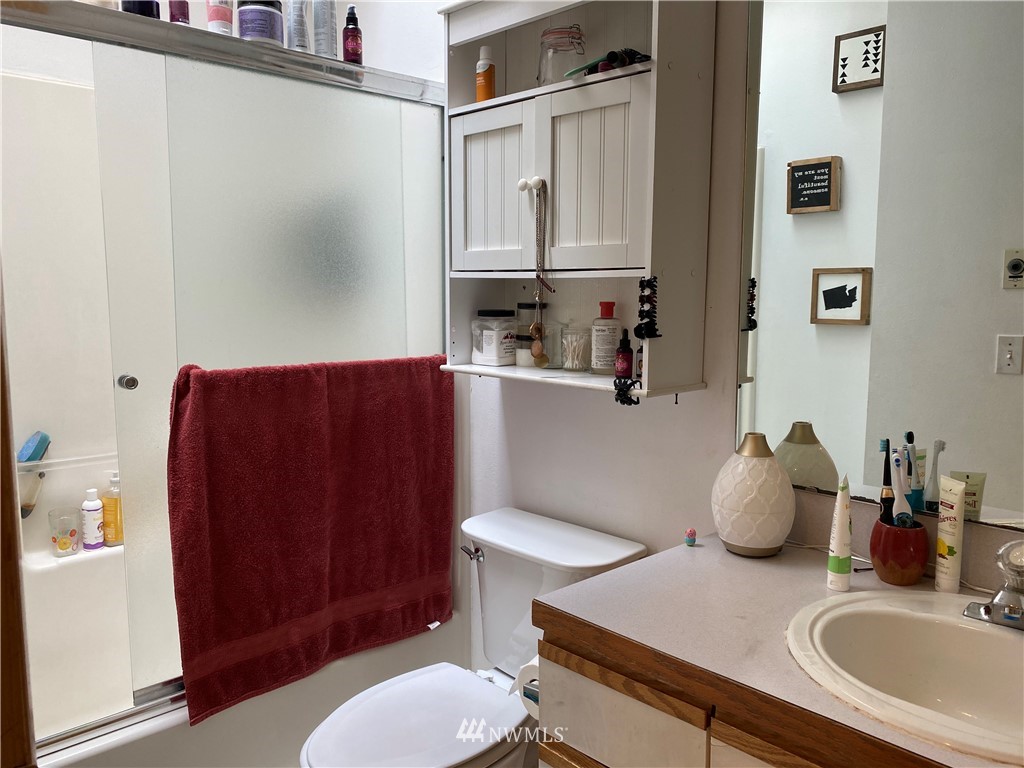 2105 Michigan Street Bellingham, WA 98229 - Photo 37 of 38 a bathroom with a sink a toilet and shower