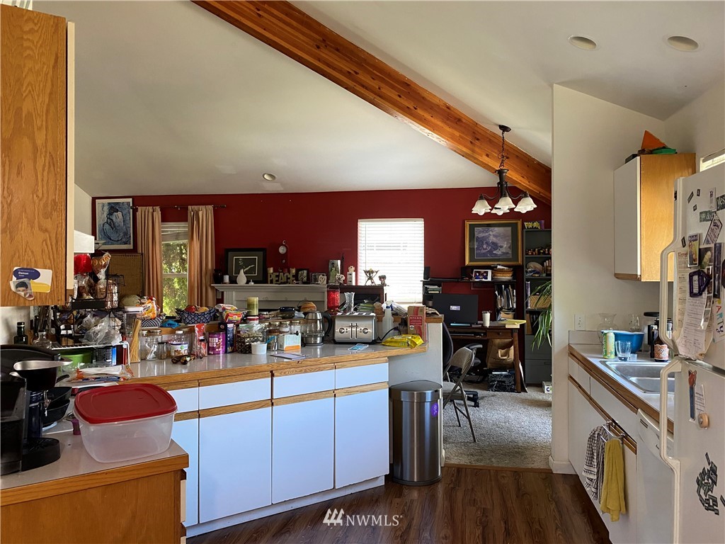 2105 Michigan Street Bellingham, WA 98229 - Photo 5 of 38 a kitchen with stainless steel appliances kitchen island granite countertop a stove and cabinets