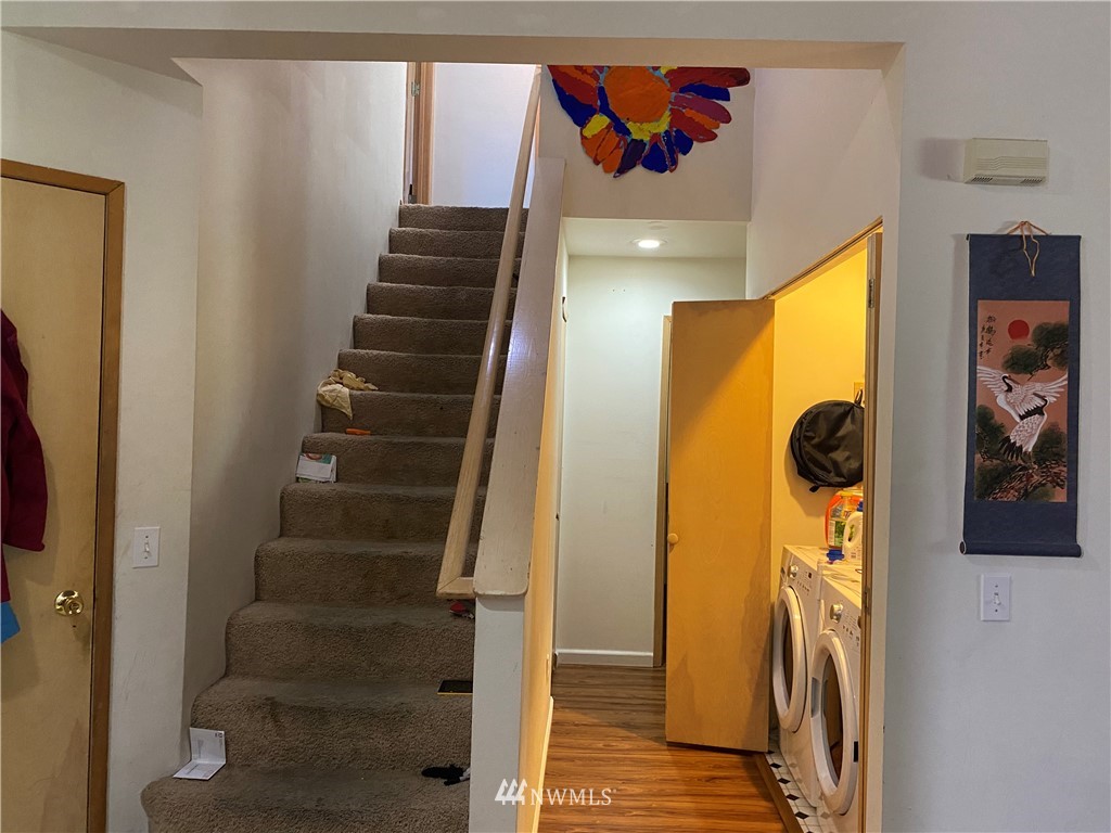 2105 Michigan Street Bellingham, WA 98229 - Photo 9 of 38 a view of hallway with stairs and wooden floor