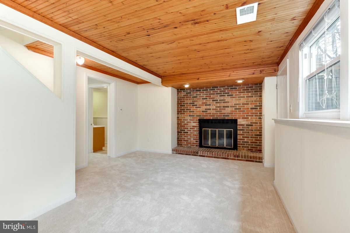 11052 Granby Court Reston, VA 20191 - Photo 19 of 28 a view of an empty room with a fireplace